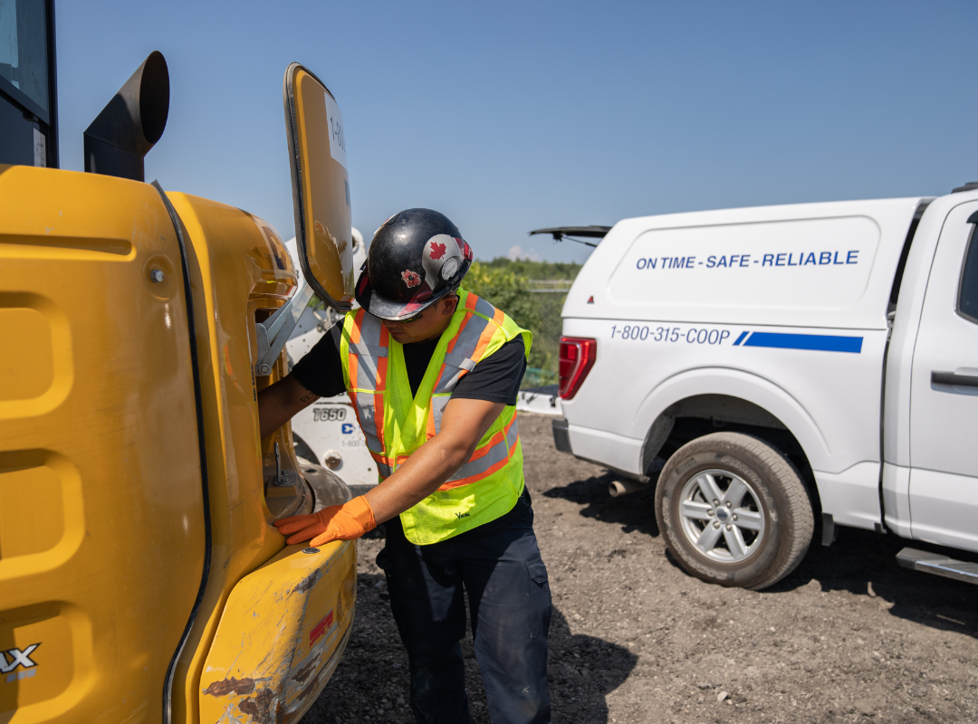 service tech fixing piece of equipment.